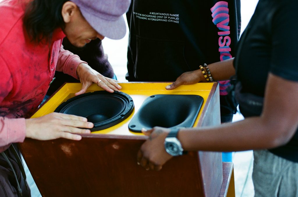 Young people building a sound system
